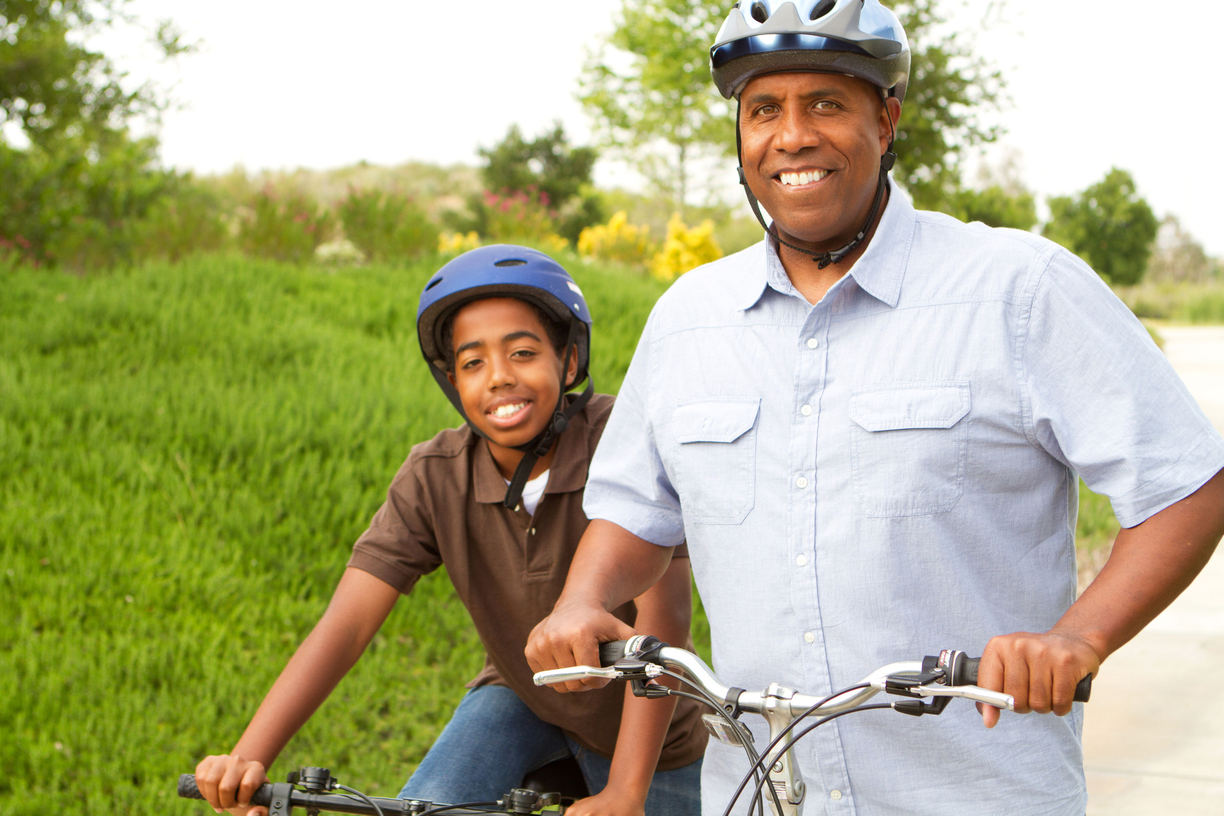 This is a photo of a father and son riding bikes.
