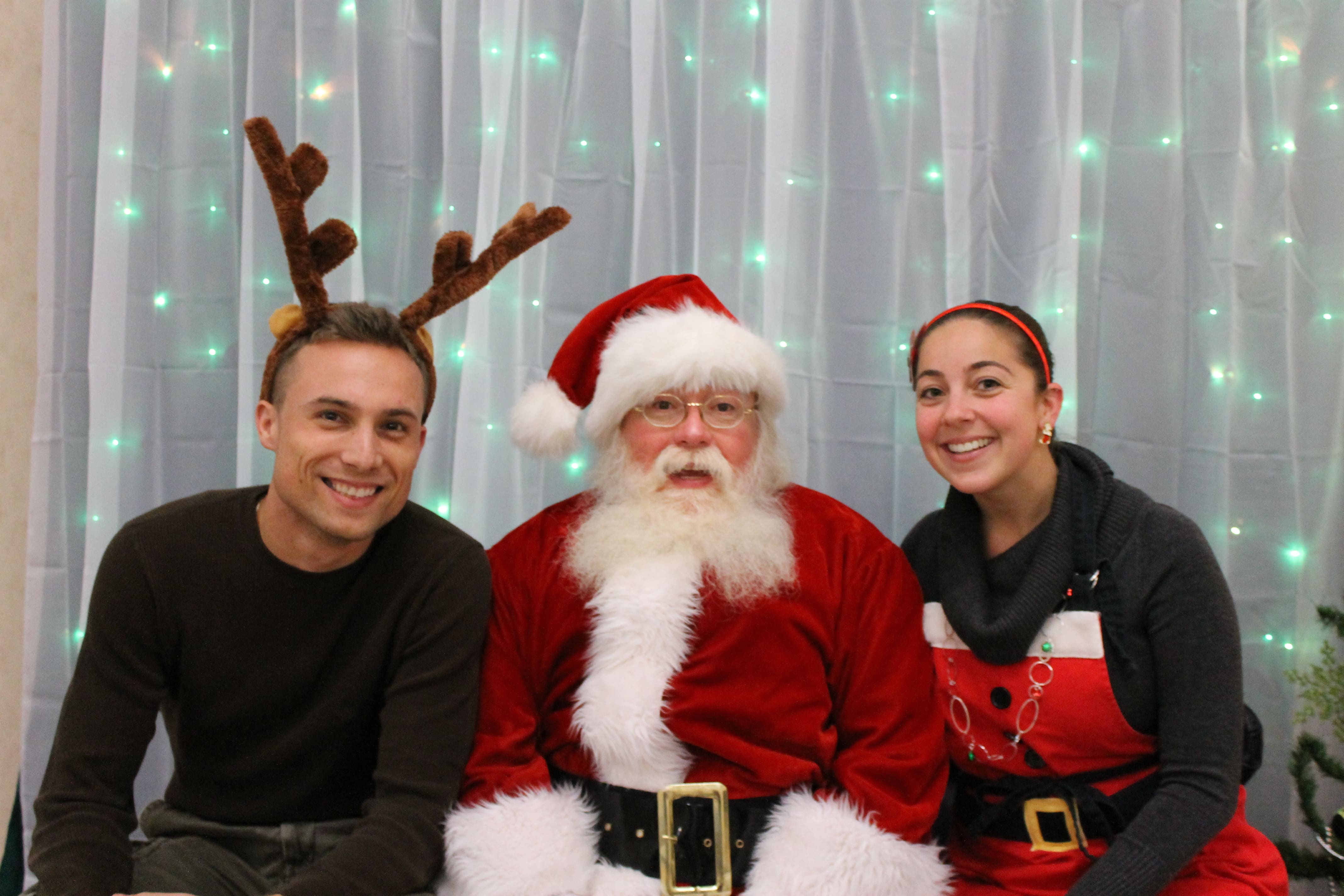 Photo of Santa and a man and woman