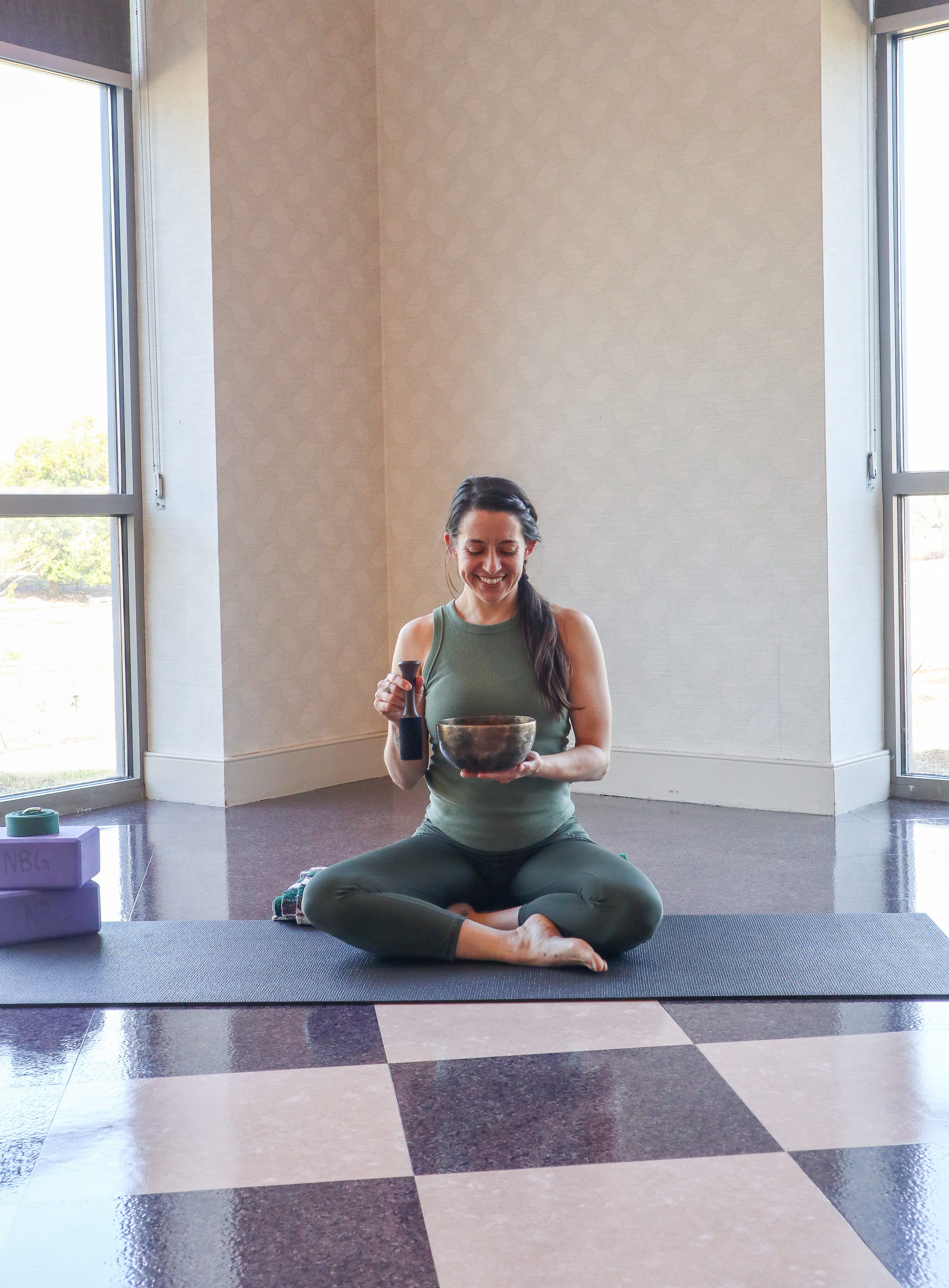 Woman doing sound bath bowls