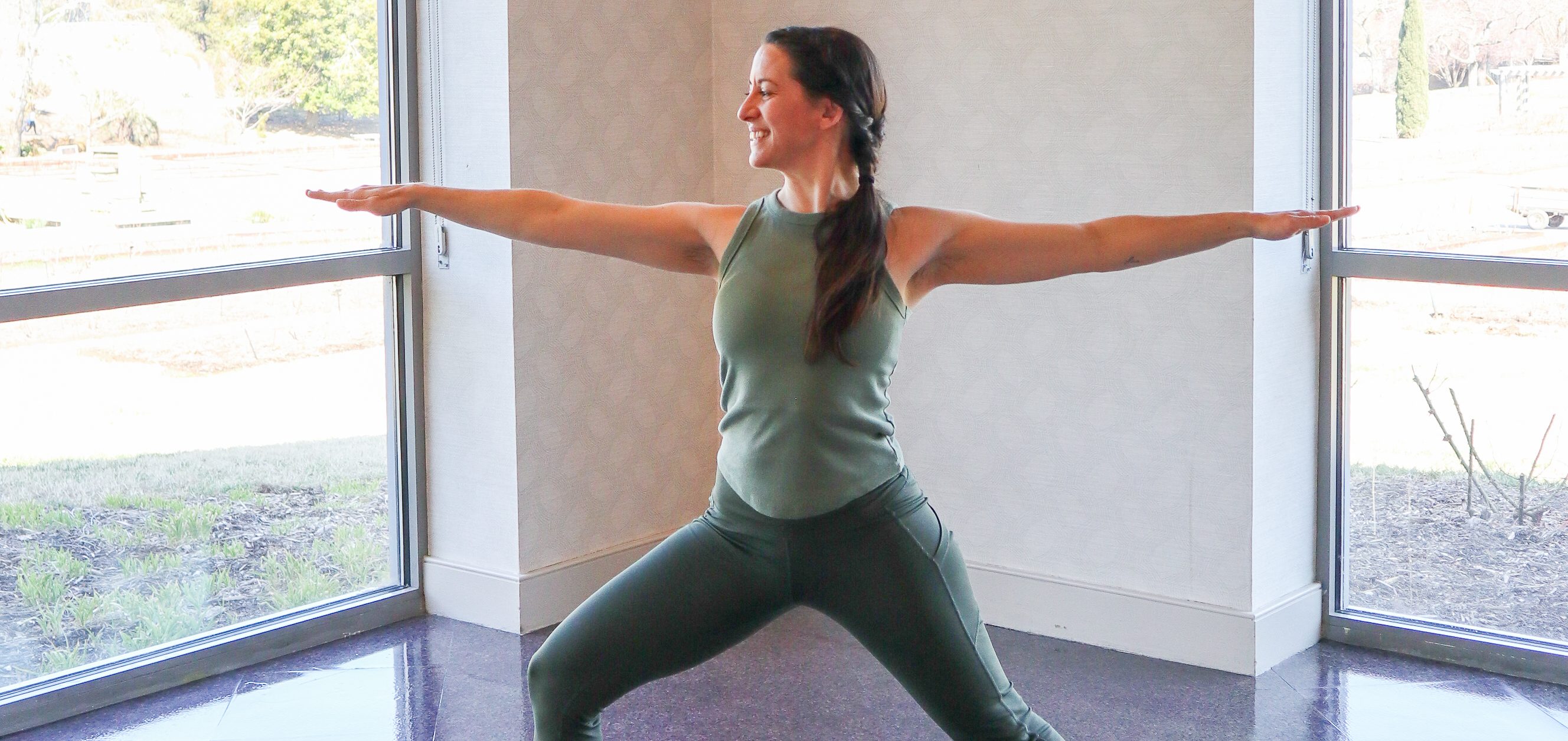 woman doing warrior yoga pose