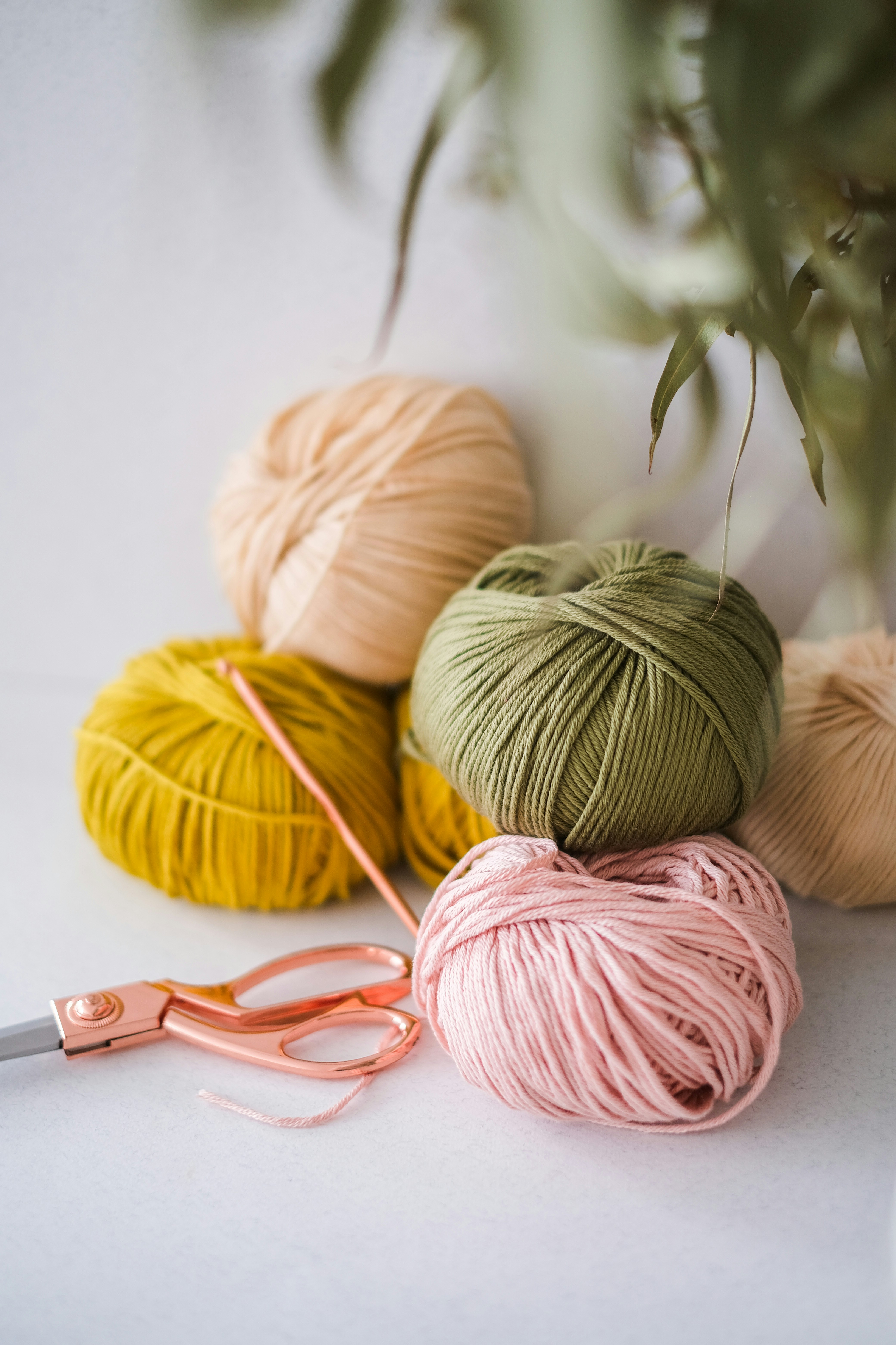5 rolls of yarn in a pile